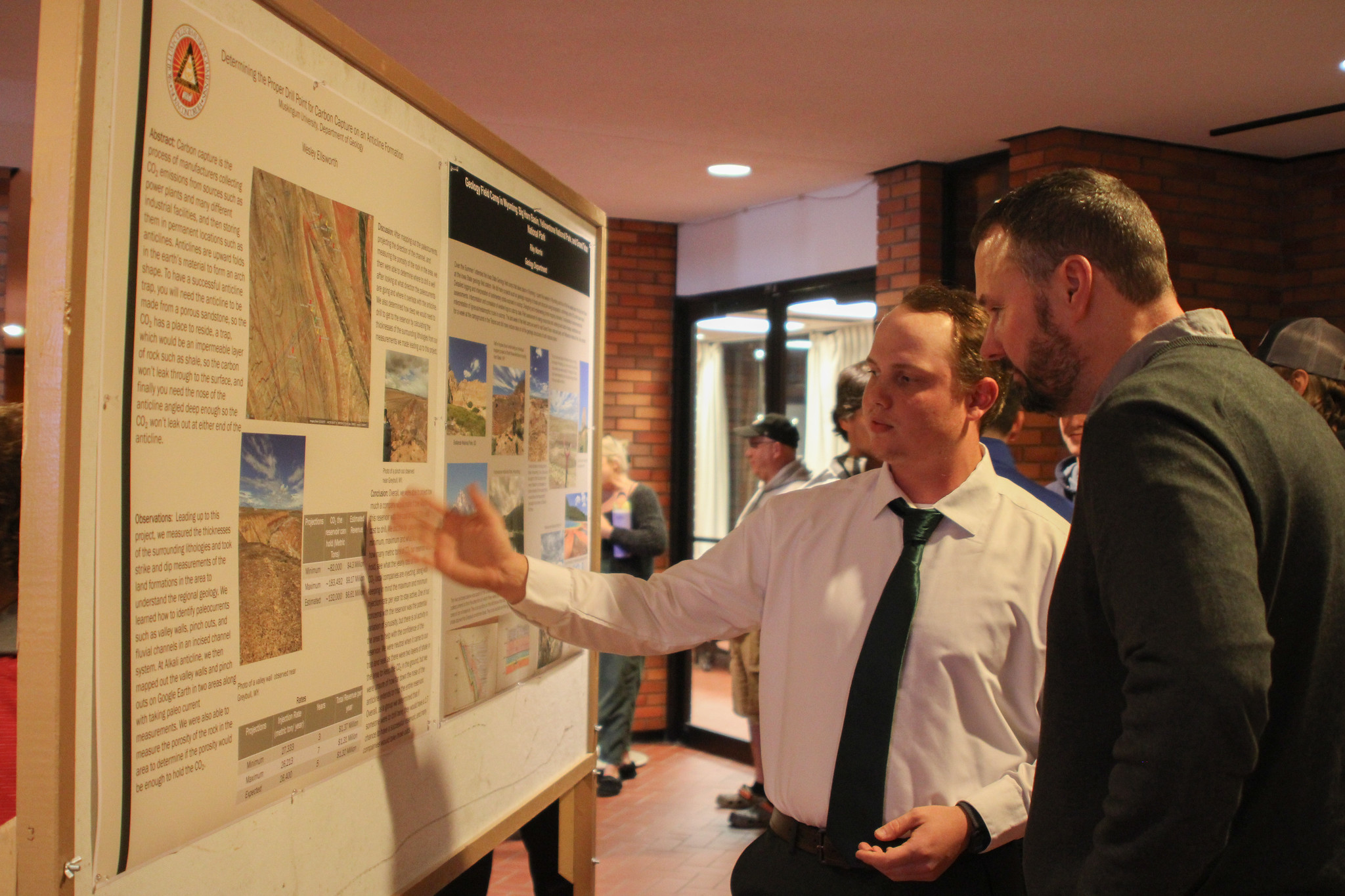 Student presenting at the poster presentation