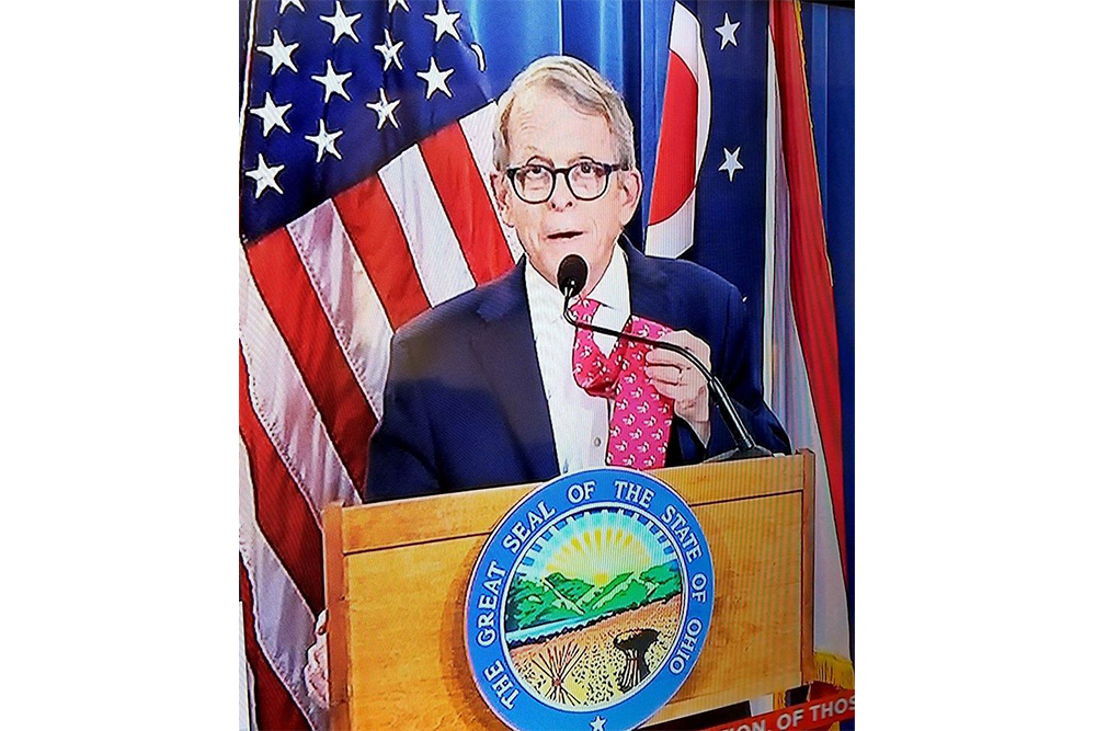 governor mike dewine showing off his Muskie tie before his press conference