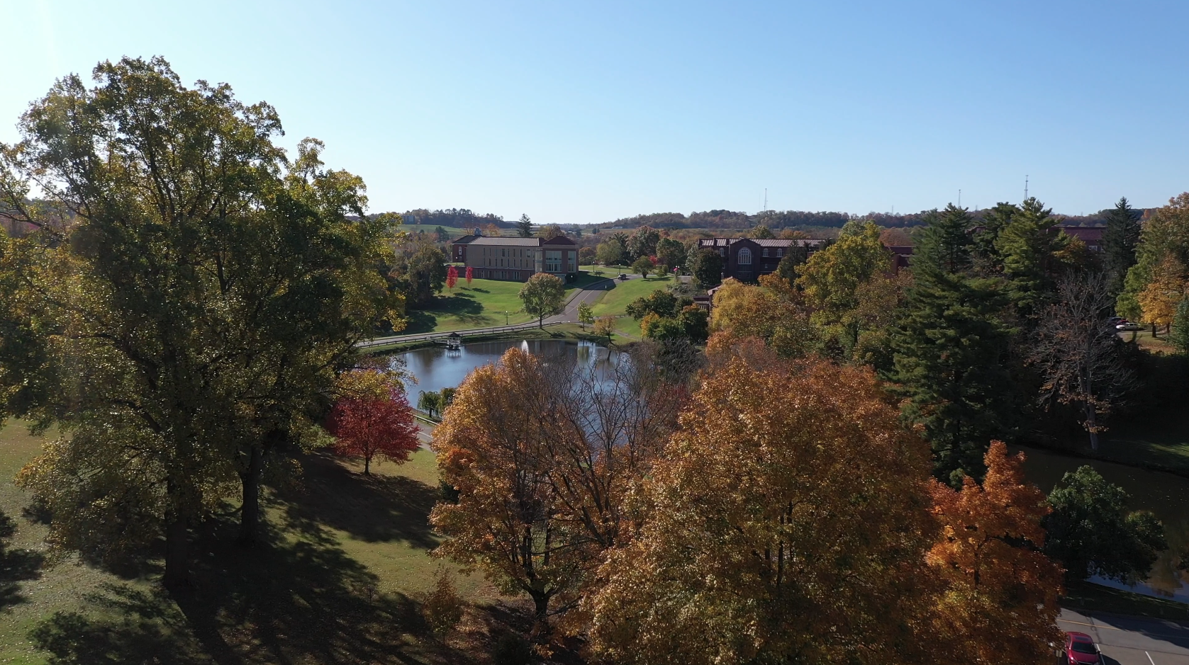 aerial shot of fall on campus showing trees with orange leaves