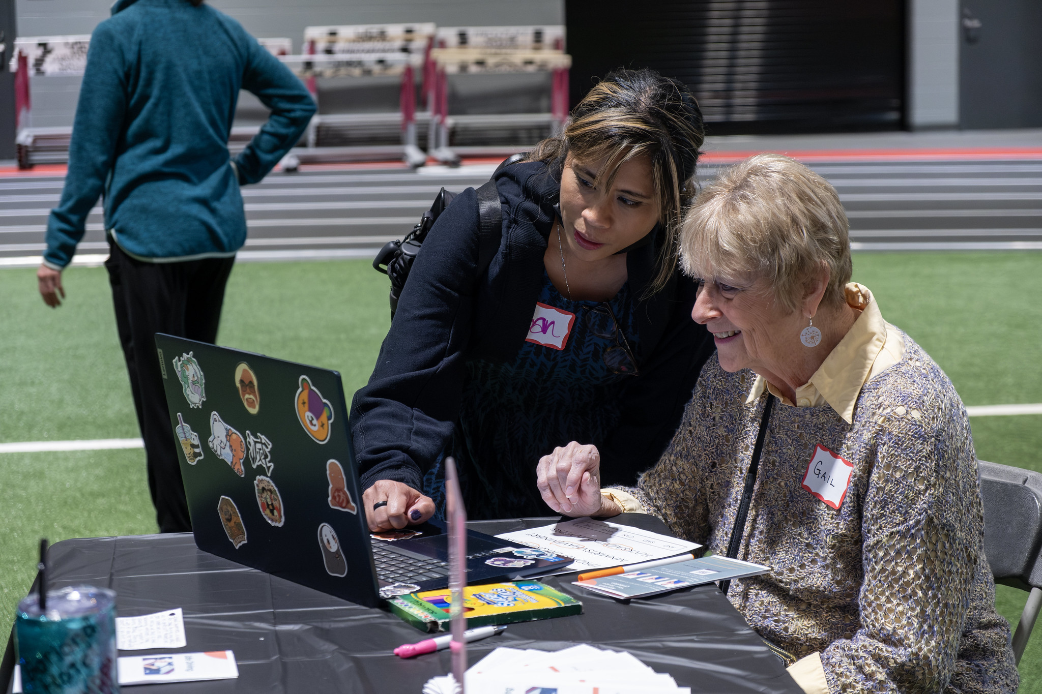 Student Helping an Attendee