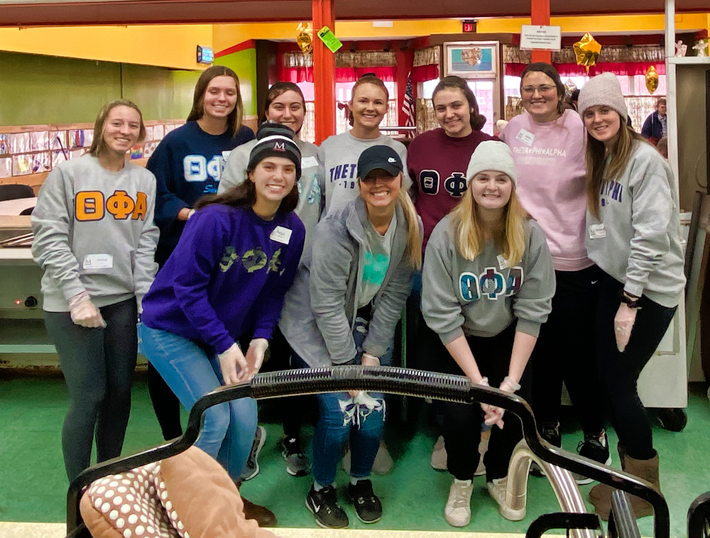 sorority members volunteer at Christ's Table in Zanesville