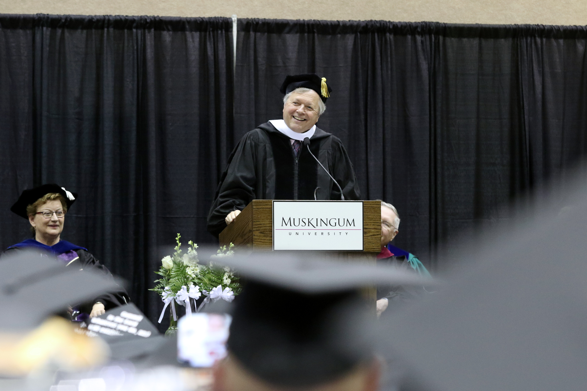 Dan Hughes speaking to the graduates