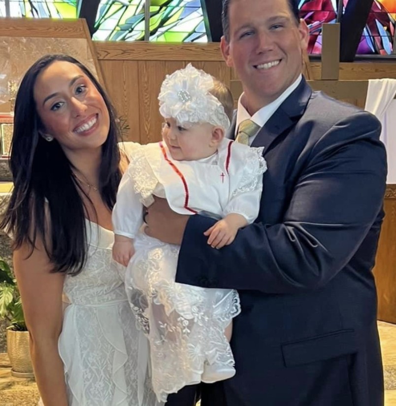 Zachary Grimm '12, with his wife Victoria, and their daughter Giulia