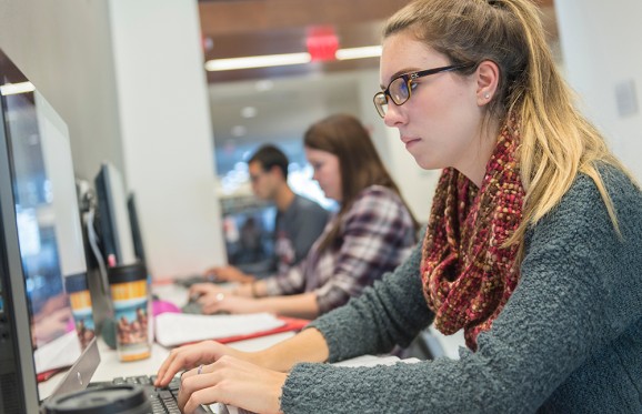 female student at computer typing