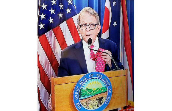 governor mike dewine showing off his Muskie tie before his press conference