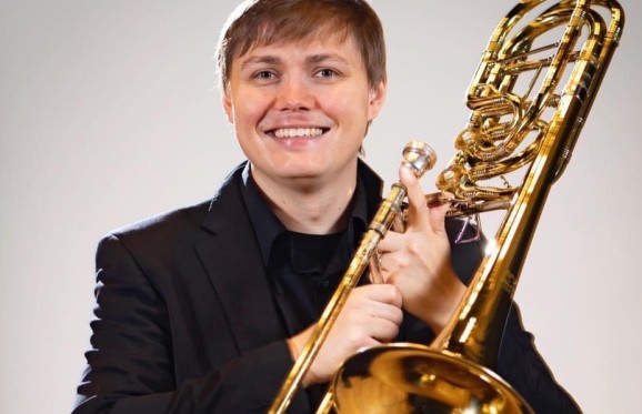 lucas kaspar photo holding an instrument