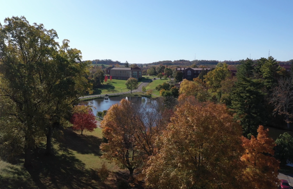 aerial shot of fall on campus showing trees with orange leaves