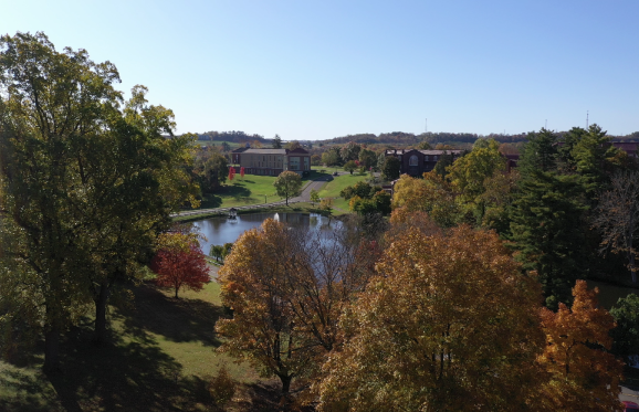 fall shot of campus trees and lake 