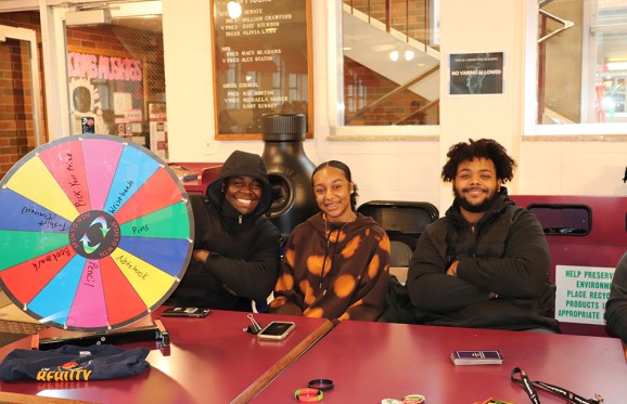 African American Students hosting a BHM trivia Table in the Bait shop on campus during Lunch Hour