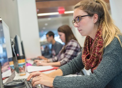 female student at computer typing