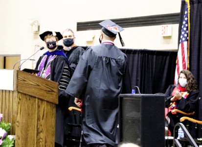 Muskingum University President Susan S. Hasseler presents diplomas to graduates