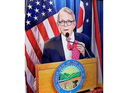 governor mike dewine showing off his Muskie tie before his press conference