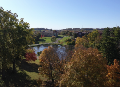 fall shot of campus trees and lake 