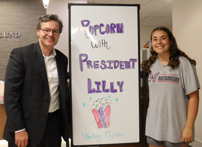 President Lilly having popcorn with the MU community