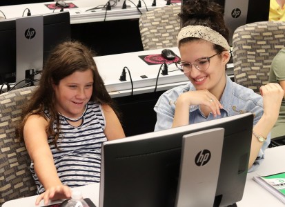 A participant receives assistance from Emily Sink